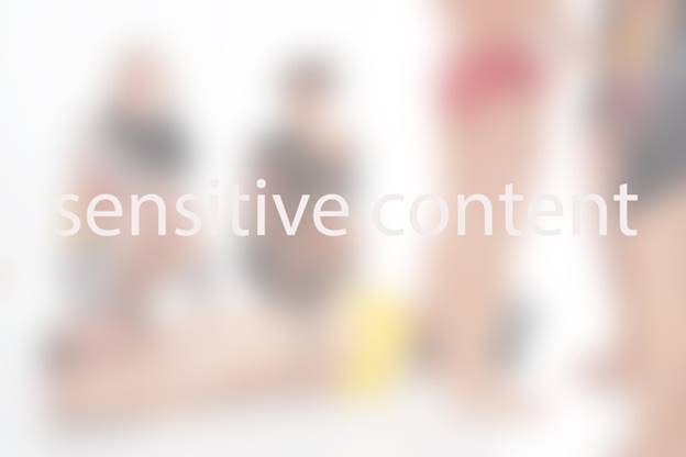 Blurred image on legal website with text overlay reading: “sensitive content.” Content block details are visible in a website builder window.